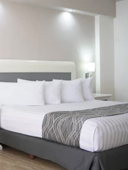 made-bed-in-hotel-room